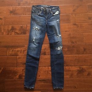 American Eagle distressed super super stretch jean